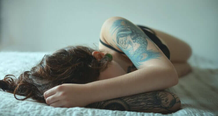 tattooed girl sleeping