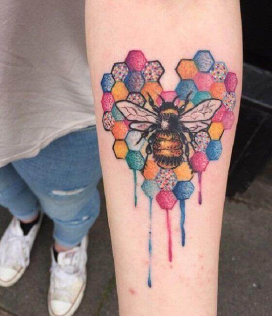 Colorful Honey bee tattoo on the men forearm