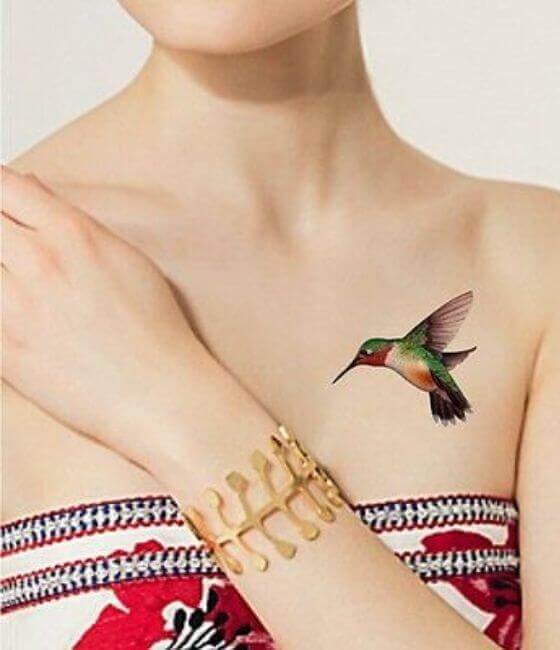 Colorfull small Hummingbird Tattoo On Women Chest