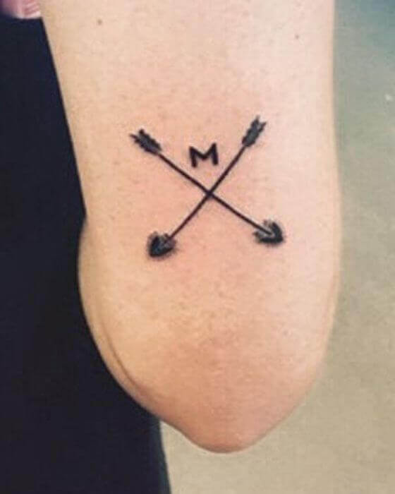 Initial Tattoo on Arm with Arrow Tattoo