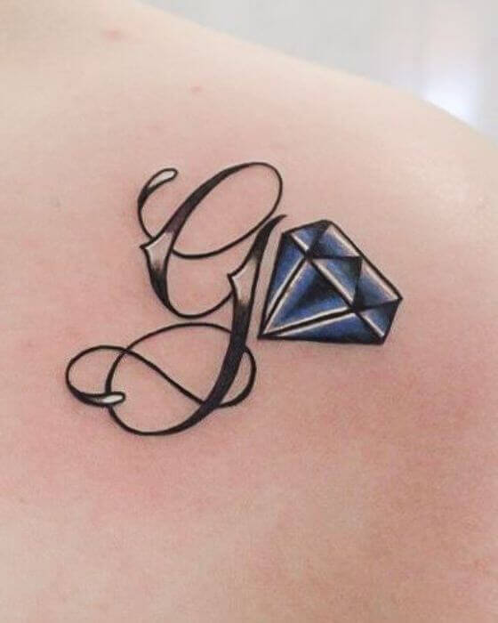 Initial Tattoo with Diamond on The Back