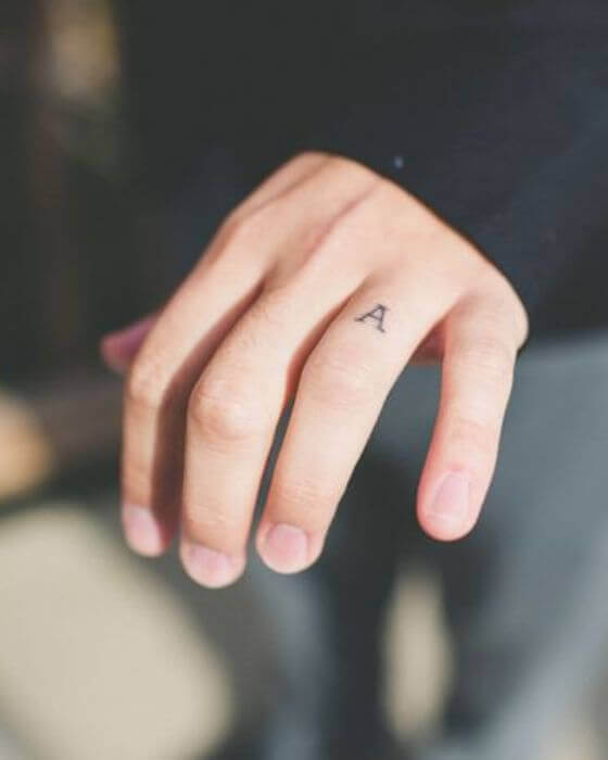 Simple Initial Tattoo on finger