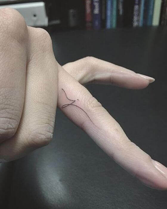 Initial Tattoo on finger 