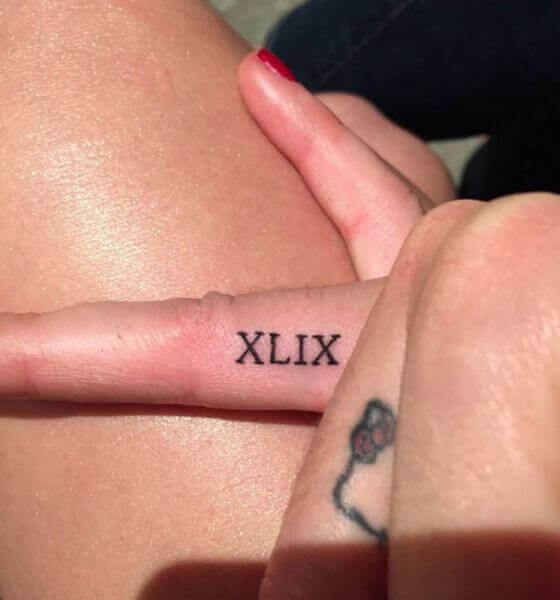 Roman Numeral Finger Tattoo