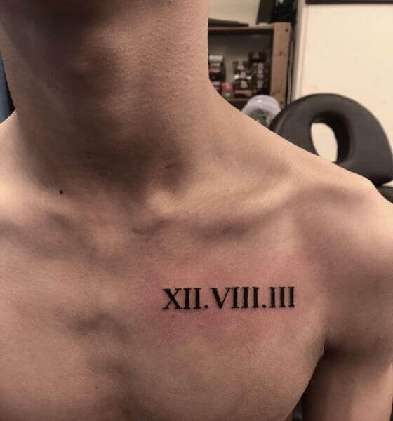 Chest tattoo of a date in roman numerals on Louis