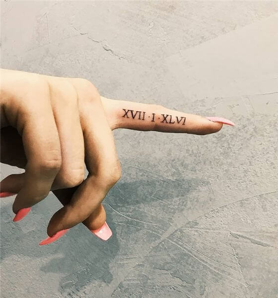 Roman Numeral Tattoo on finger 