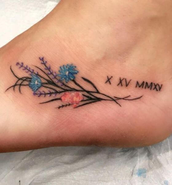 Roman Numerals Tattoo with flower on foot 