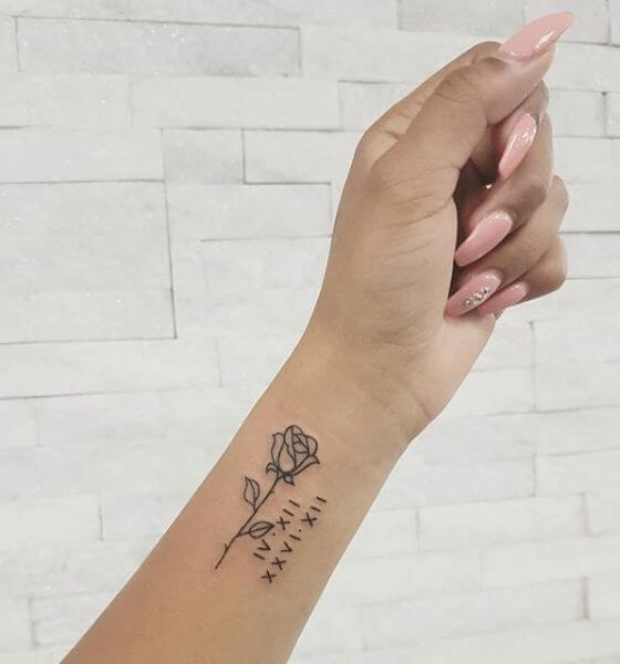 Rose with Roman Numerals Tattoo on wrist 