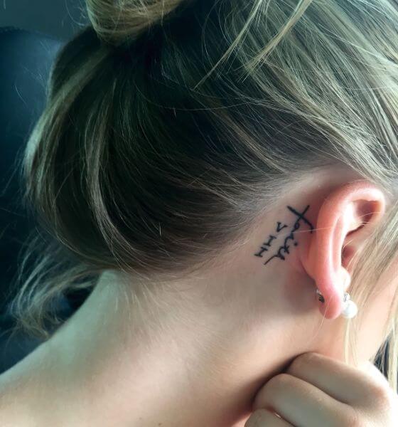 Best Roman Numerals Tattoo on behind the ear