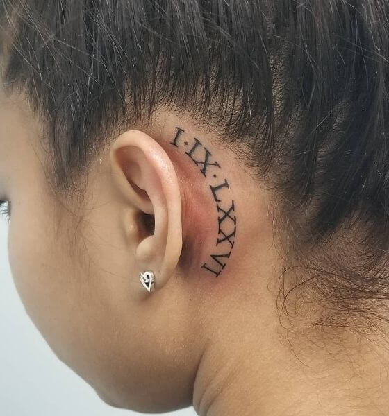 Roman Numerals Tattoo on behind the ear 