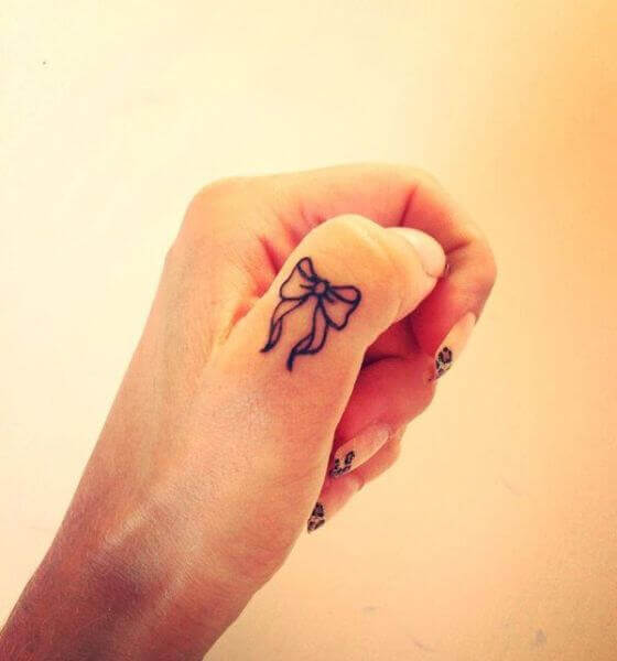 Ribbon Finger Tattoo