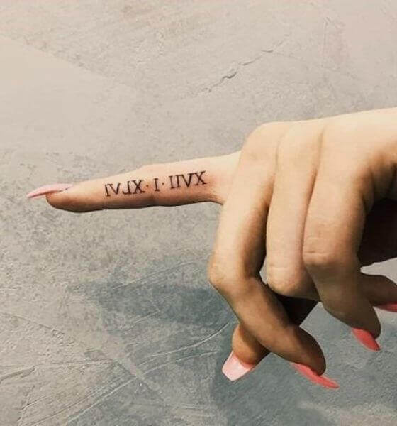 Roman Numeral Finger Tattoo