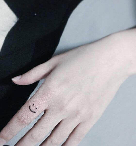 Smiley Face Finger Tattoo