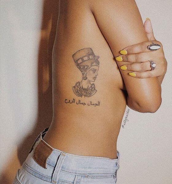 The Arabic quote tattoo on her ribcage