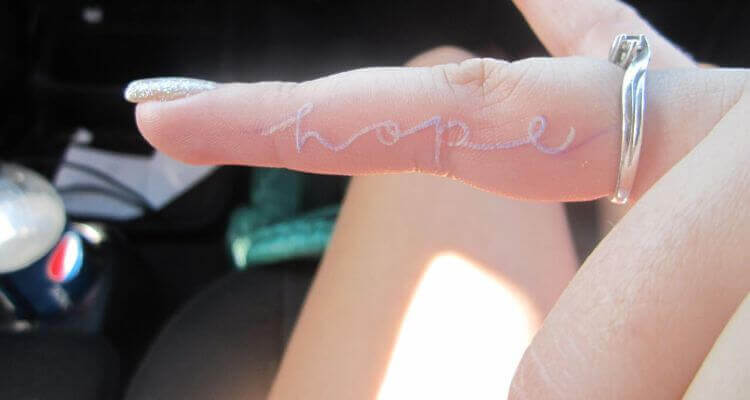 Beautiful White Ink Tattoo on Finger