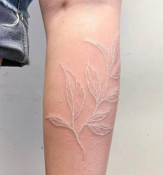 Beautiful white ink tattoo on hand