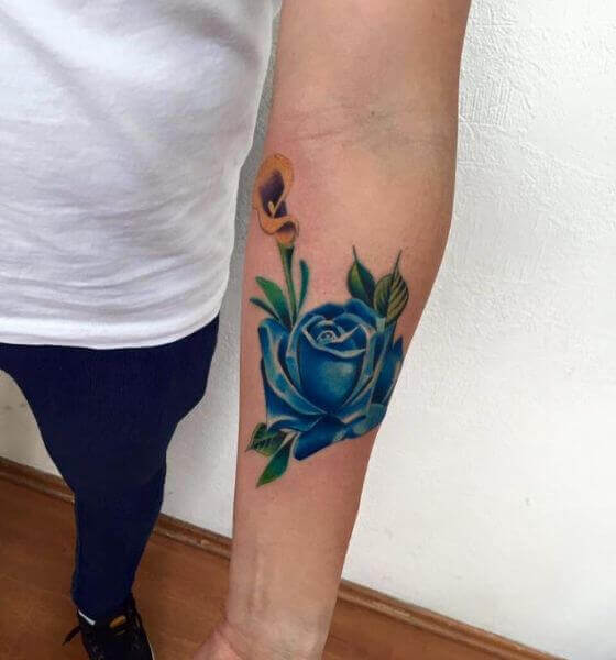 Blue rose tattoo on hand