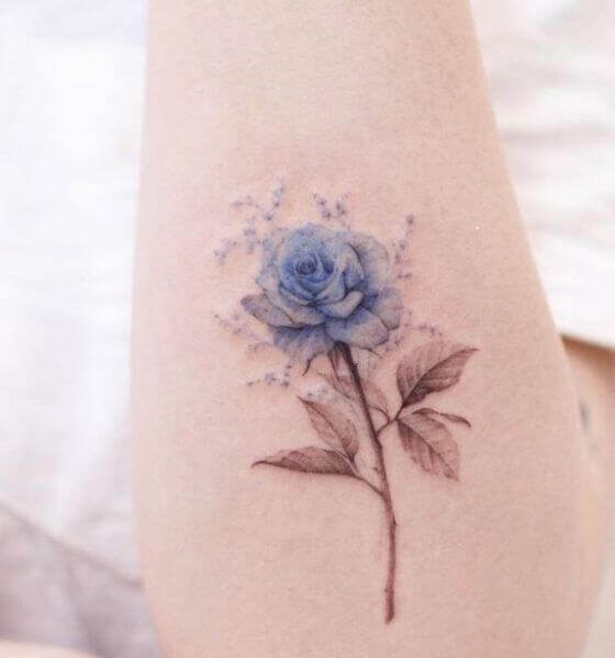 Blue rose tattoo on hand