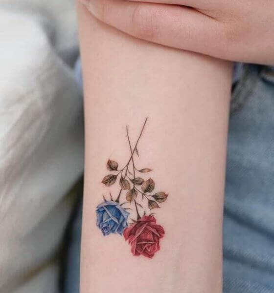 Two-color rose tattoos on hand