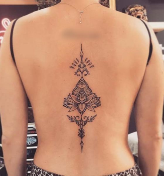 Lotus Flower Tattoo in a Triangle on Spine