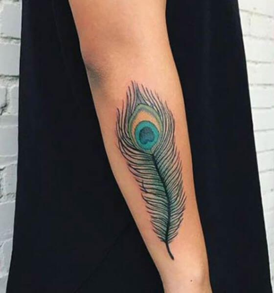 peacock feather tattoo on thigh