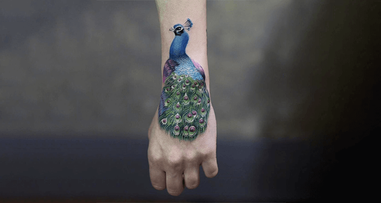 Stunning Peacock Tattoo Design on Hand