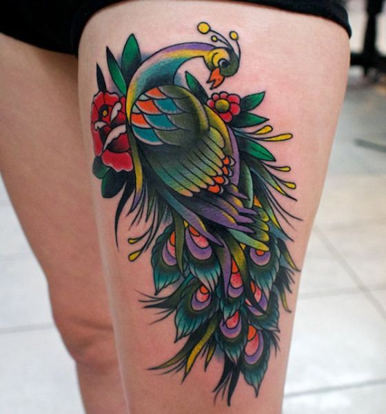 Swirls peacock tattoo on thigh