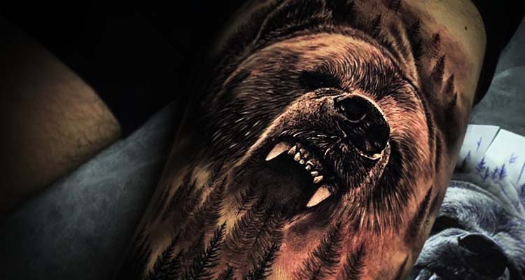 Illustrative bear tattoo on the left chest