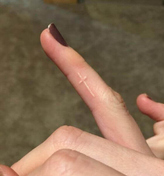 White Ink Cross Tattoo on Finger