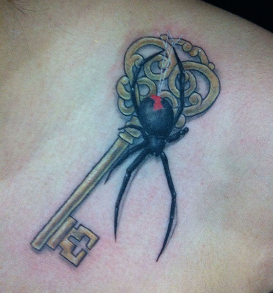 Key and spider tattoo