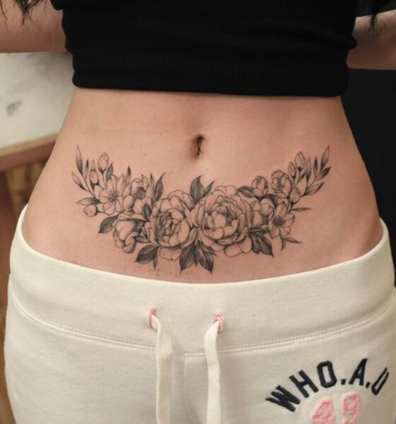 Pretty Flower Tattoo on Women's Stomach