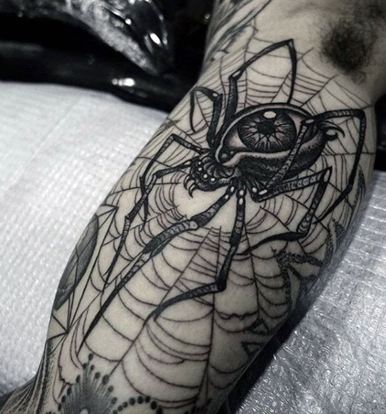 Spider tattoo on sleeve