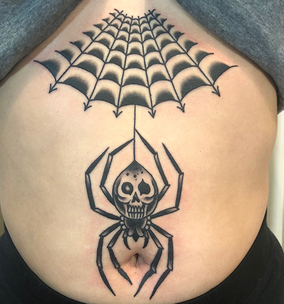 Spider tattoo on stomach