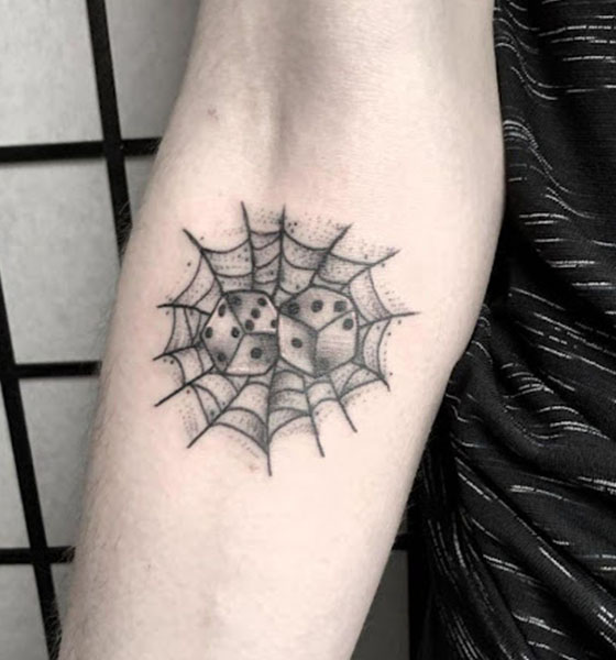 Spider tattoo with a dice