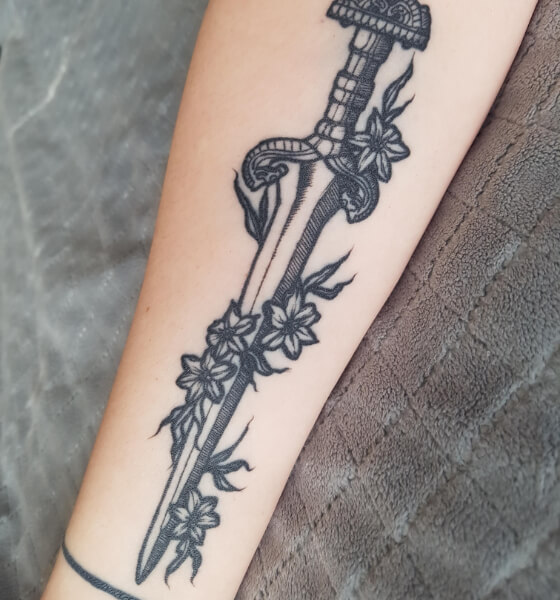 Black Ink Sword With Snake Tattoo On Right Forearm