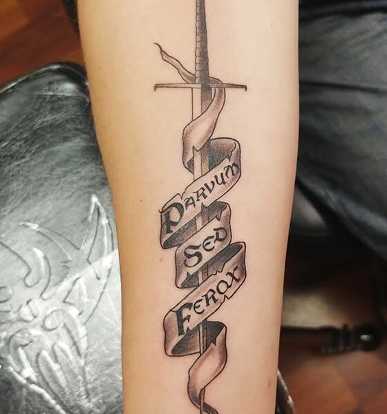 Micro-realistic style sword tattooed on the forearm.