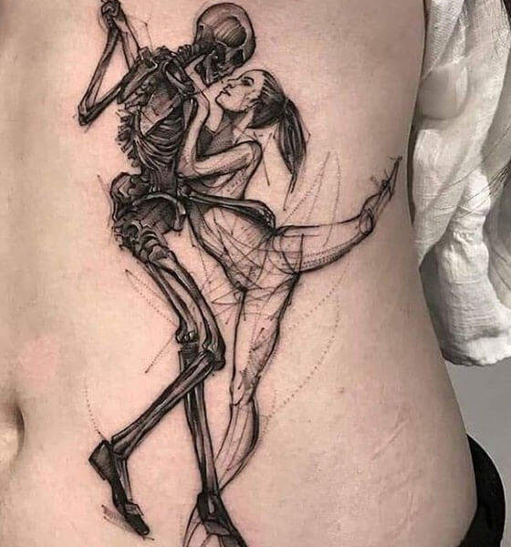 Two skeletons tattoo on stomach