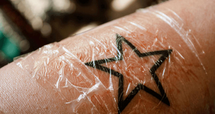 Why Do Tattoo Artists Cover a New Tattoo with Plastic Wrap?