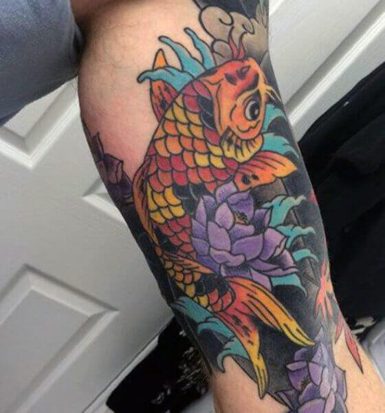Colorful koi fish tattoo on leg