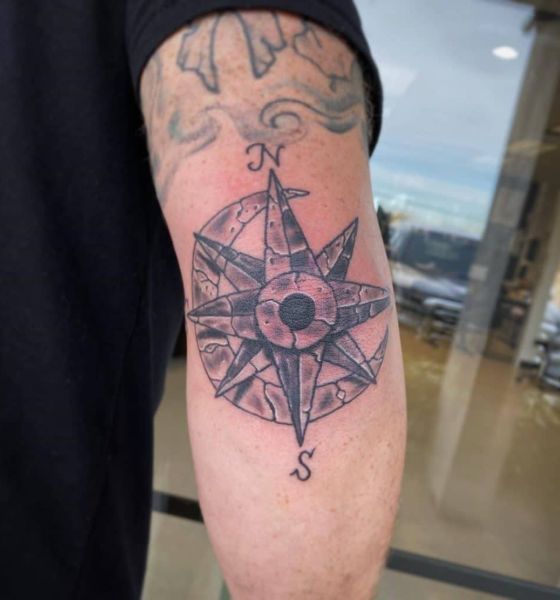 Compass tattoo on elbow