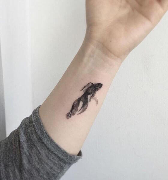 Cute Koi fish tattoo on wrist