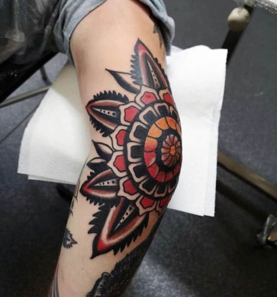 Flower tattoo on elbow