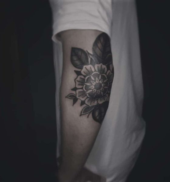 Flower tattoo on elbow