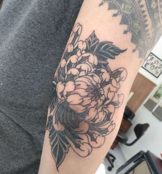 Gorgeous flower tattoo on elbow