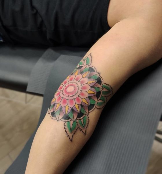 Pretty flower tattoo design on elbow