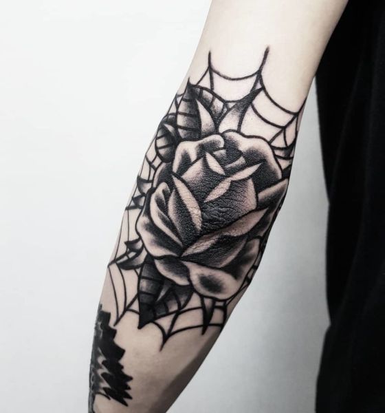 Rose tattoo design on elbow