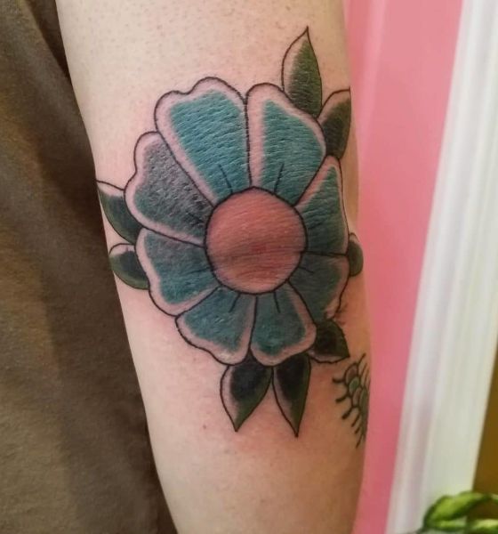 Simple flower tattoo on elbow for girls