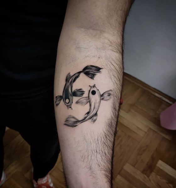 Yin-Yang Koi Fish Tattoo on Arm