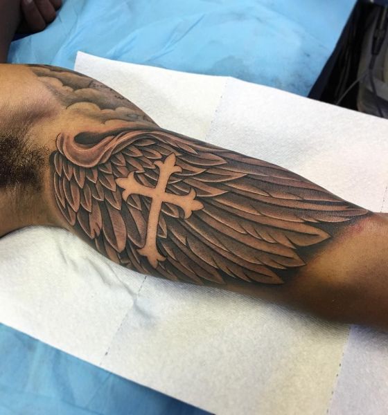 Angel wing tattoo on the inner bicep