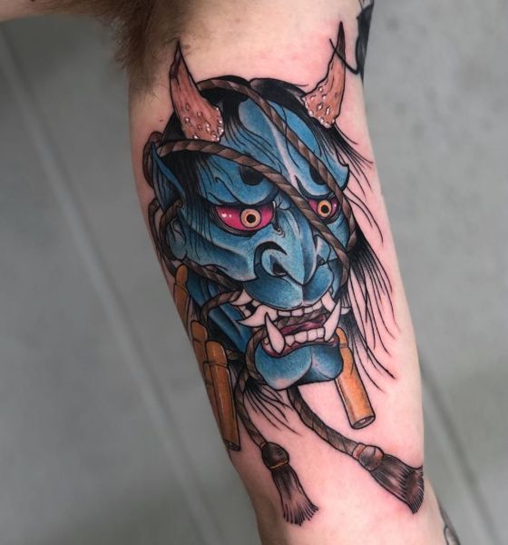 Mask Tattoo on Inner Bicep